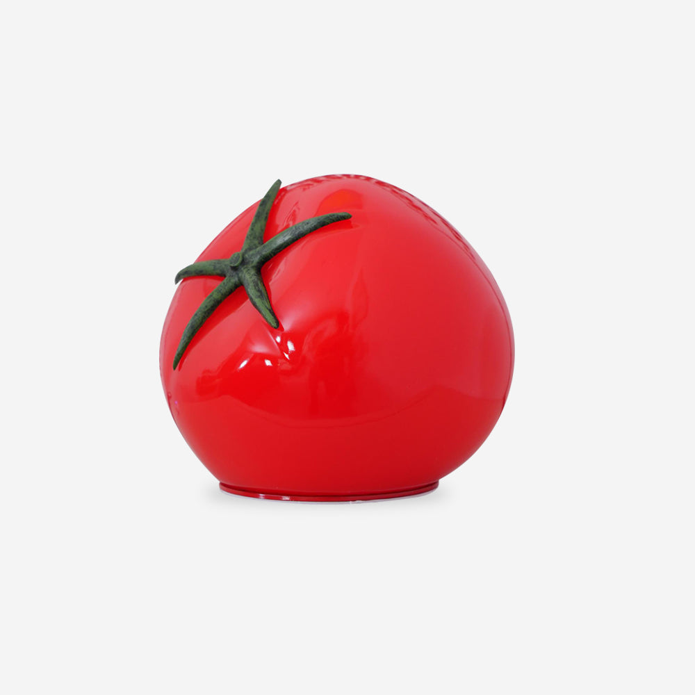 Red Tomato Glass Table Lamp glowing on a table